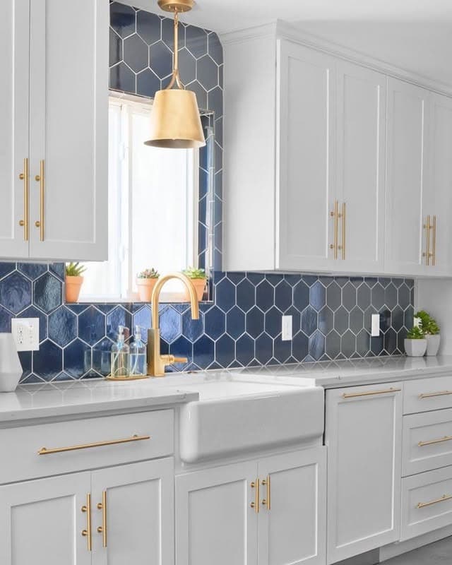 3. Deep Navy Hexagon Tile with Brass Accents - kitchen backsplash ideas