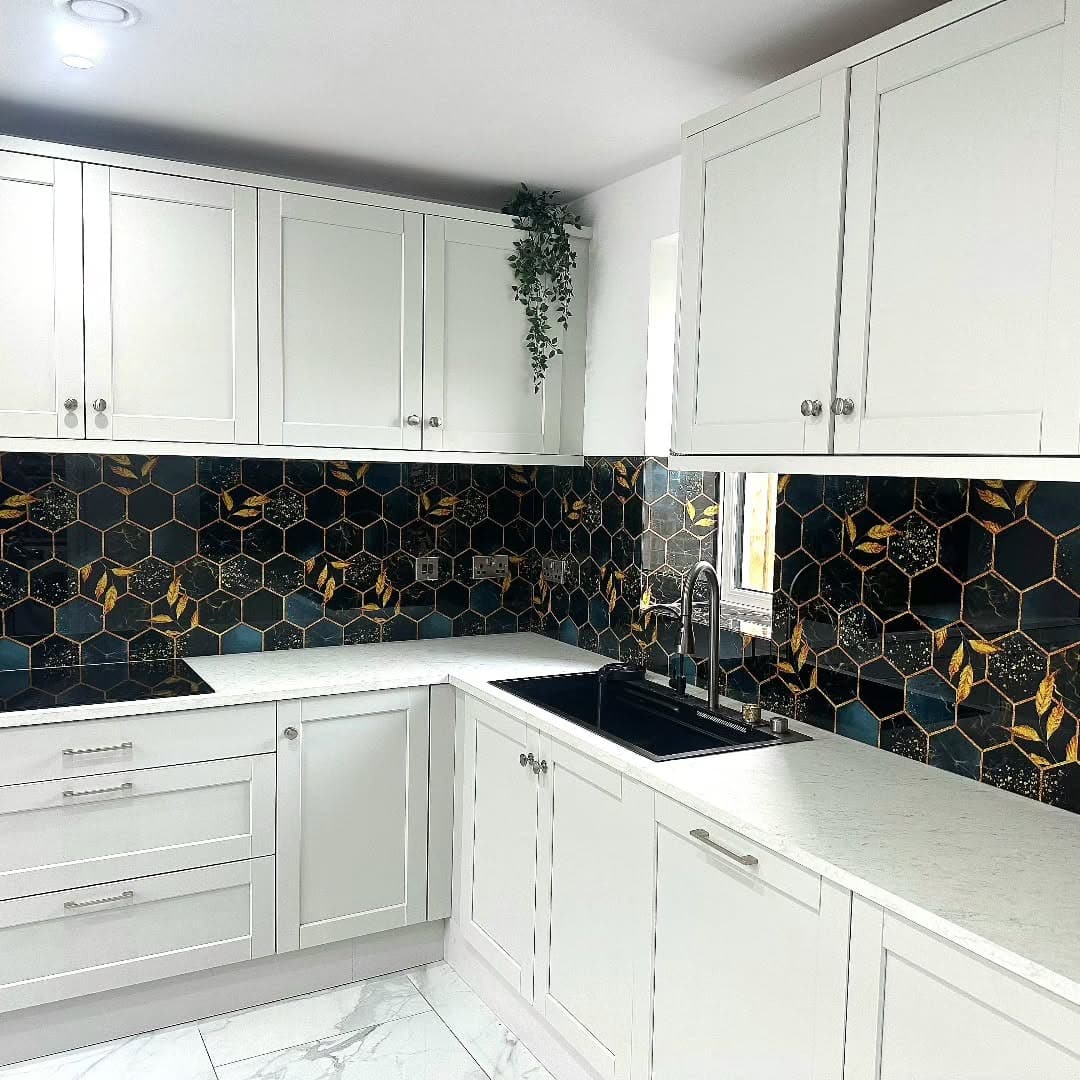 8. Black and Gold Honeycomb Tile with White Cabinetry - kitchen backsplash ideas