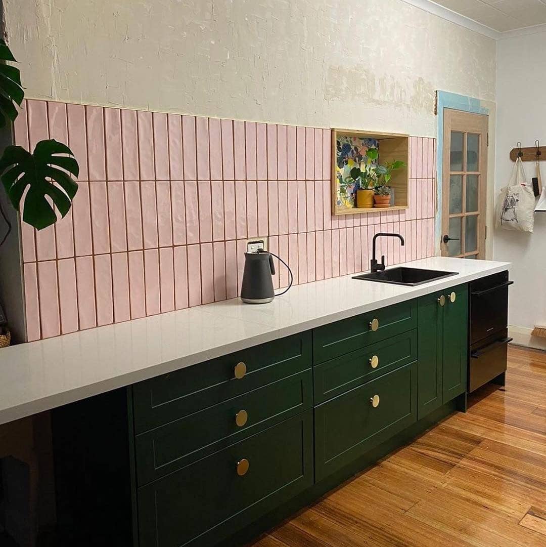 13. Soft Pink Vertical Tile with Dark Green Cabinetry - kitchen backsplash ideas