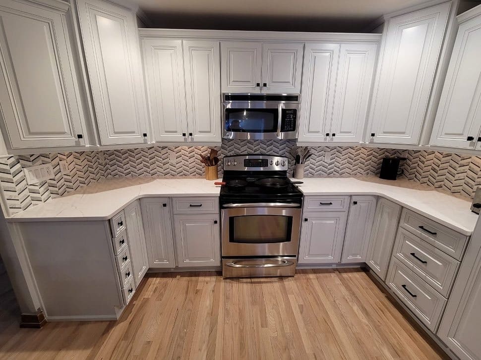 15. Chevron Marble Mosaic with Soft White Cabinetry - kitchen backsplash ideas