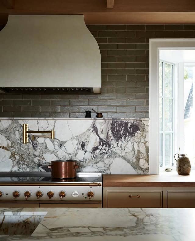 17. Olive Subway Tile and Dramatic Marble Slab Accent - kitchen backsplash ideas