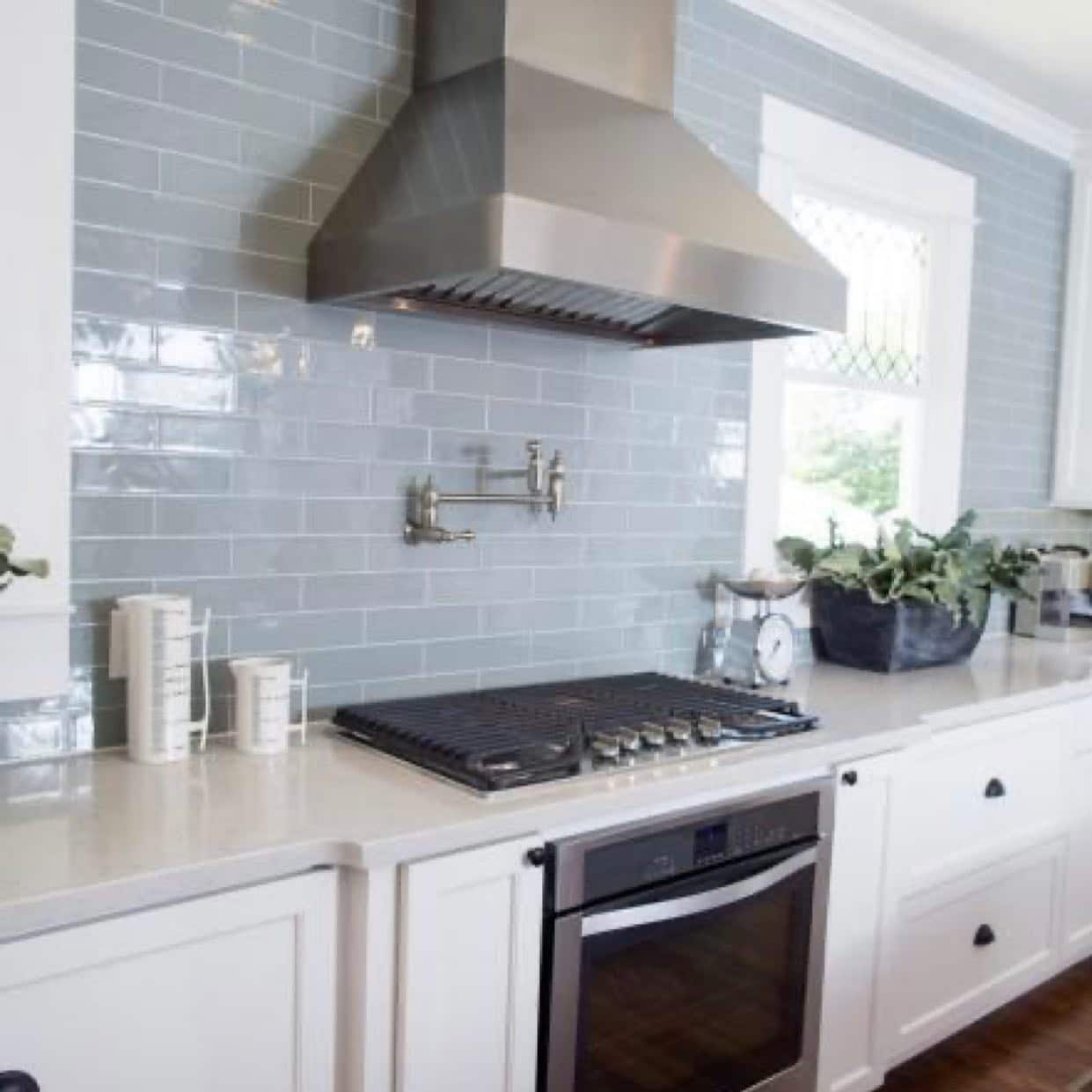 19. Soft Blue Glossy Subway Tile in a Bright White Kitchen - kitchen backsplash ideas