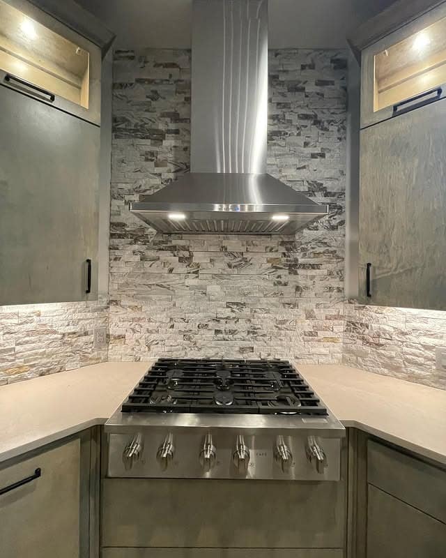20. Stacked Stone Backsplash with Stainless Hood - kitchen backsplash ideas