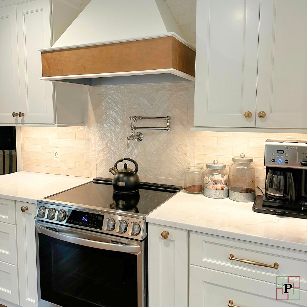 21. Soft Cream Herringbone Tile with Classic White Cabinetry - kitchen backsplash ideas