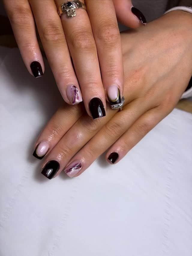 3. Deep Espresso and Marble Accent Nails - subtle nail ideas