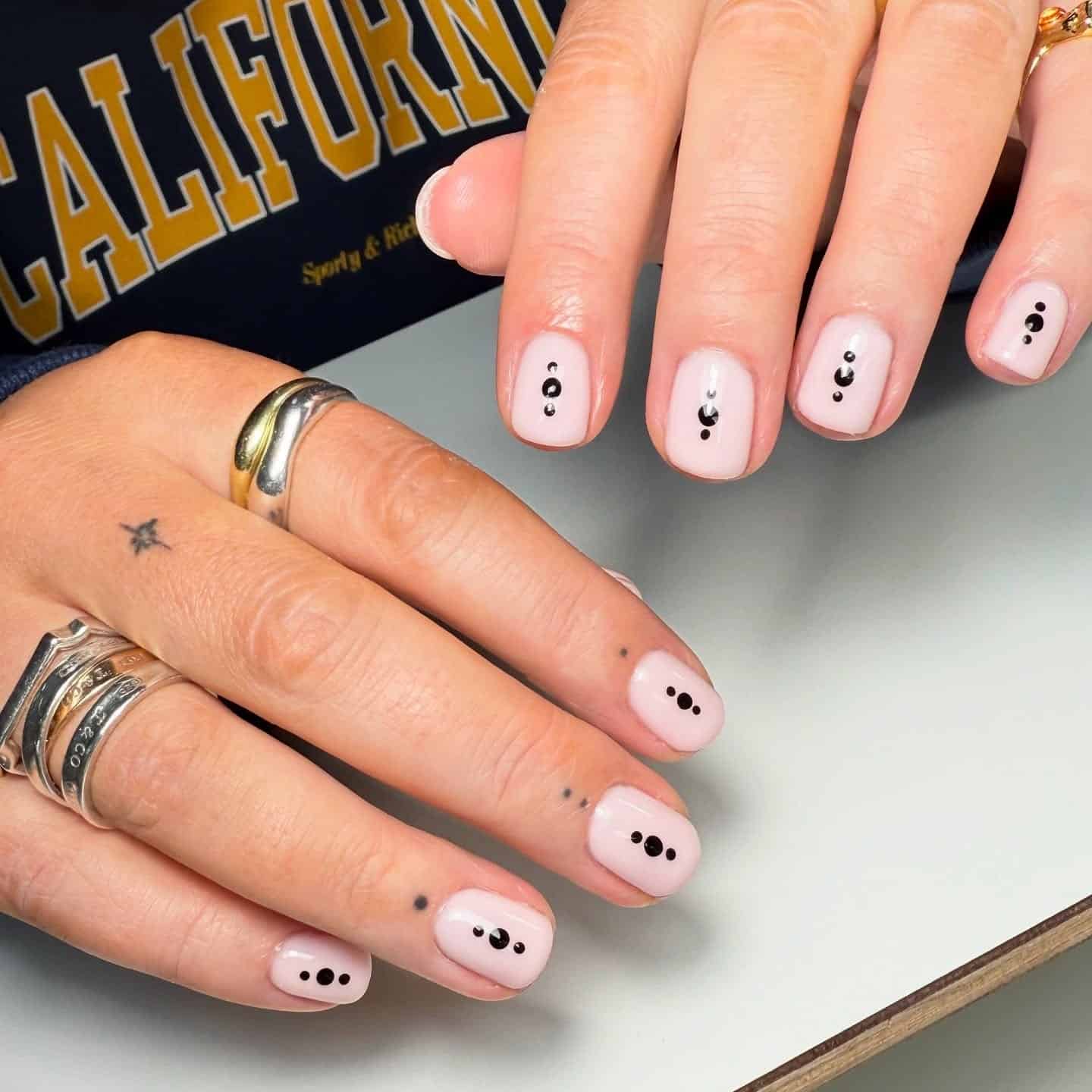 21. Minimal Dot Detail on Soft Pink Nails - subtle nail ideas