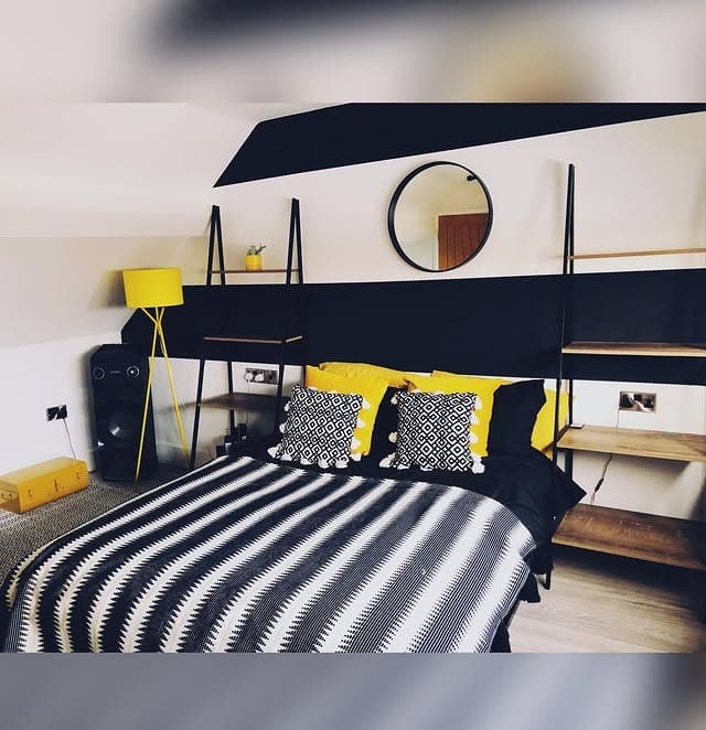 3. Modern Edge with Industrial Character - black and yellow bedroom ideas