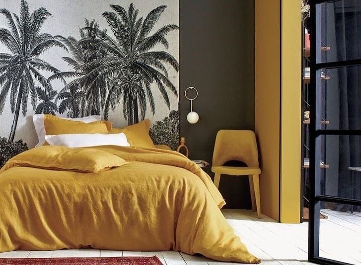4. Tropical Warmth with Golden Layers - black and yellow bedroom ideas
