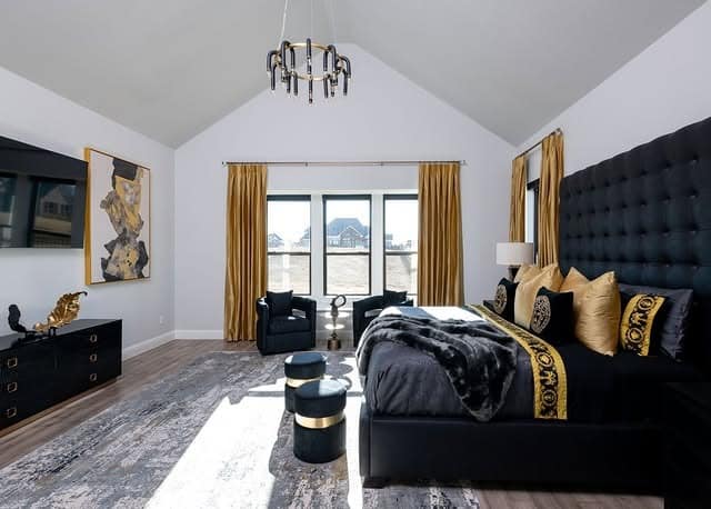 12. Grand Black Upholstery with Gold Accents - black and yellow bedroom ideas