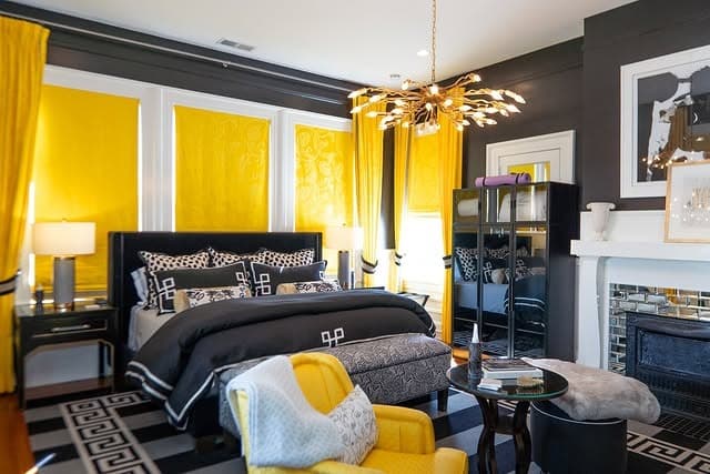 14. Patterned Elegance with Golden Panels - black and yellow bedroom ideas