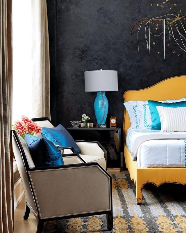 20. Blue Accent Glam with a Golden Bedframe - black and yellow bedroom ideas
