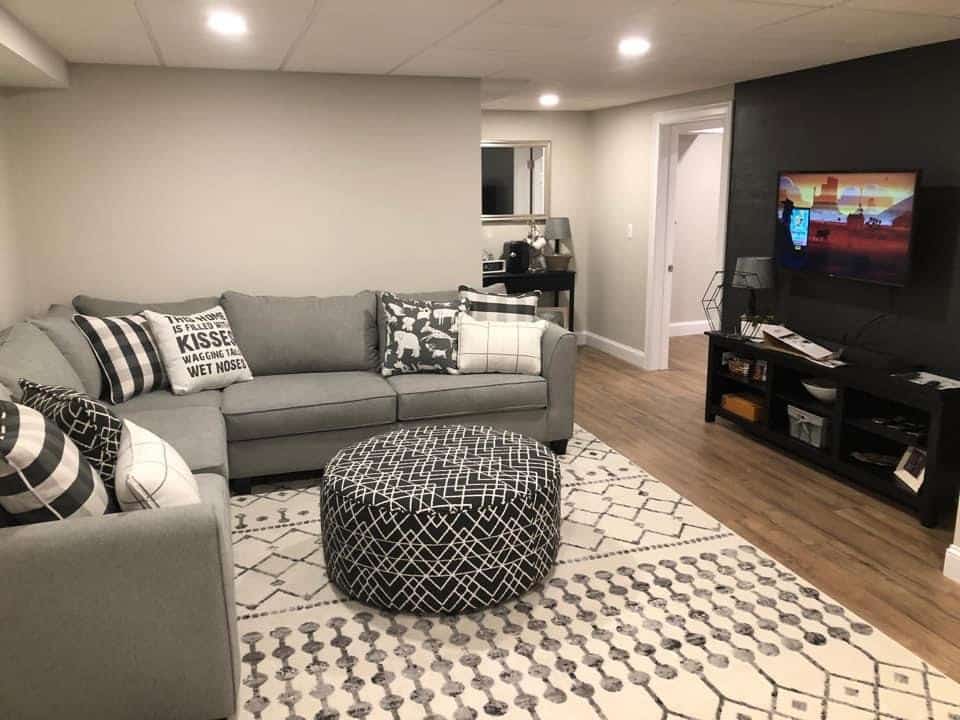 1. Modern Gray Lounge with Pattern Play - basement living room ideas