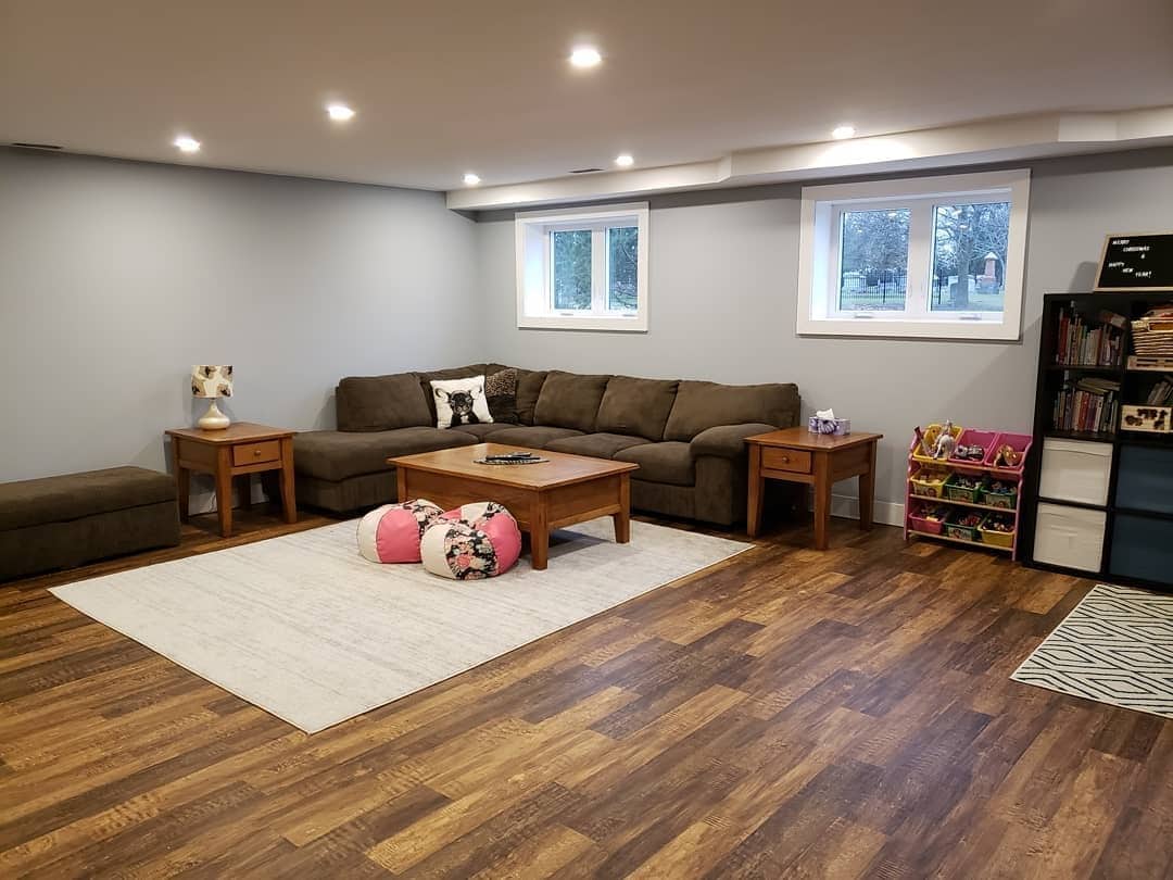 2. Family-Friendly Space with Warm Wood Accents - basement living room ideas