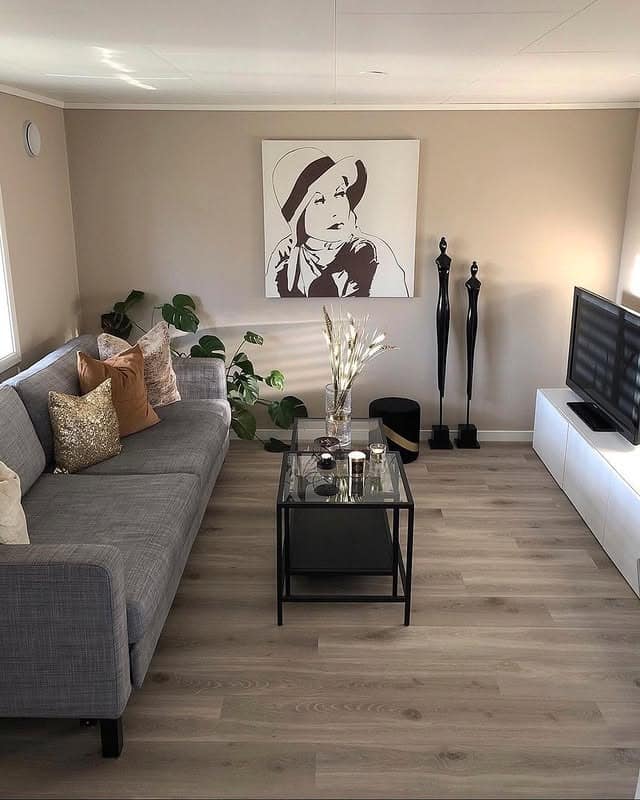 8. Compact Modern Lounge with Monochrome Art - basement living room ideas