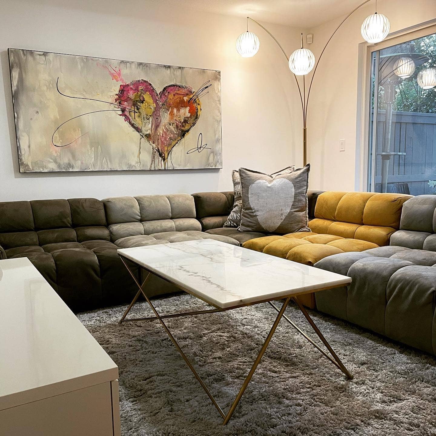 9. Color-Blocked Sectional with Vibrant Artwork - basement living room ideas