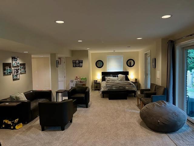 11. Multi-Purpose Basement Suite in Warm Neutrals - basement living room ideas