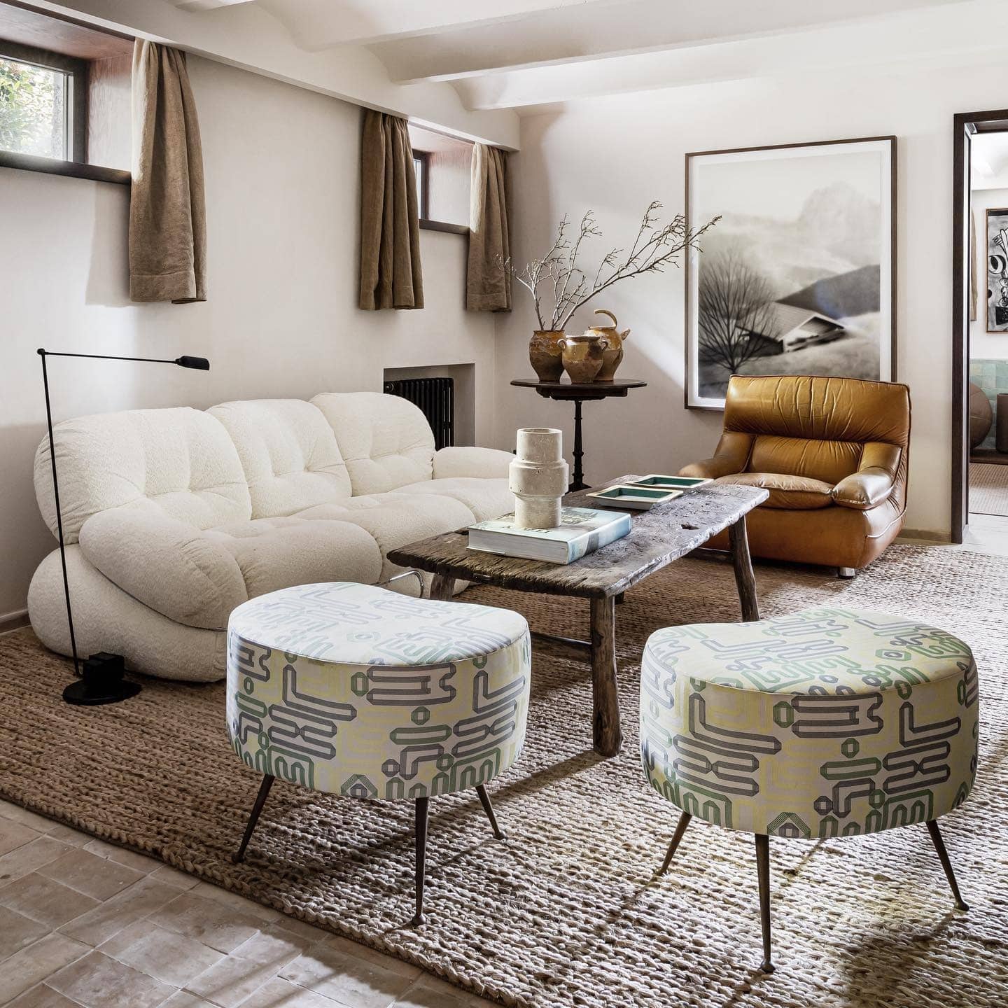 16. European-Inspired Basement with Textural Warmth - basement living room ideas