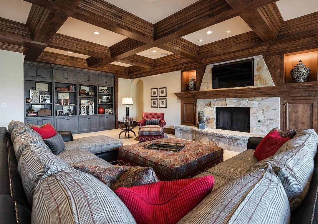 20. Traditional Basement with Timber Detailing and Stone Fireplace - basement living room ideas