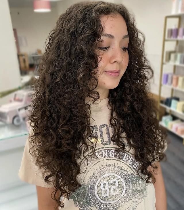 17. Lengthy Curly Layers in Soft Cocoa Brown - Layered Curly Hairstyles