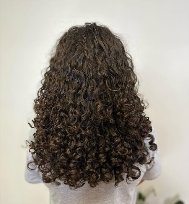 19. Layered Spiral Curls in Medium Chestnut Brown - Layered Curly Hairstyles