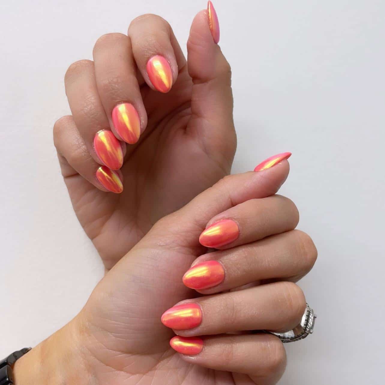 3. Iridescent Coral Glow Nails - summer coral nail ideas