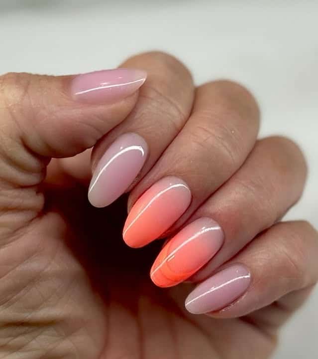 18. Soft Coral Ombre on Almond Tips - summer coral nail ideas