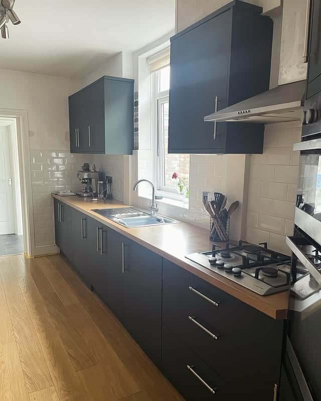 4. Charcoal Matte with Warm Wood Accents - kitchen cabinet paint ideas