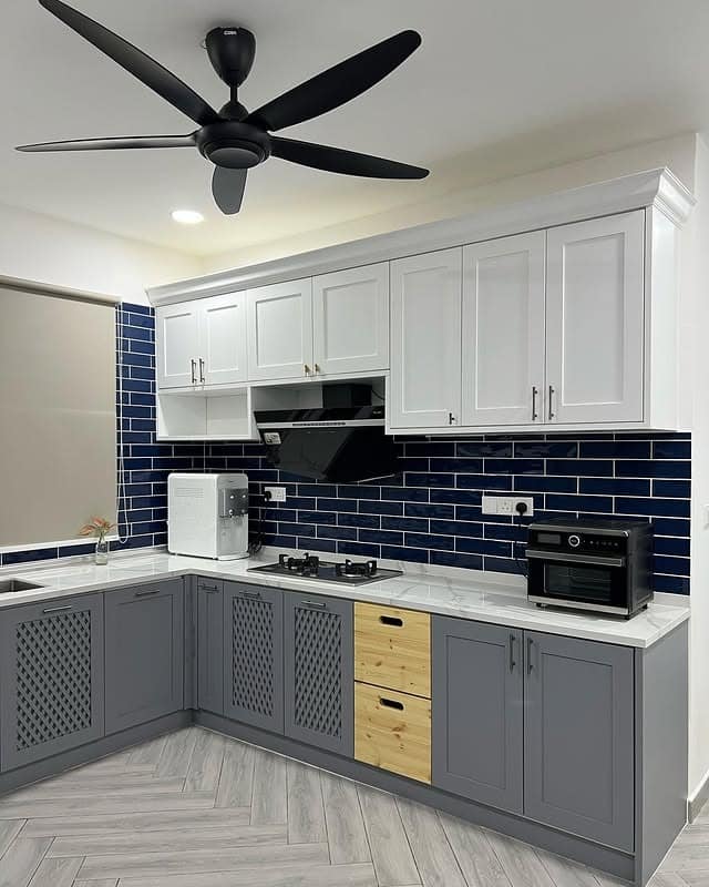 9. Gray & White Contemporary with Navy Tile Accent - kitchen cabinet paint ideas