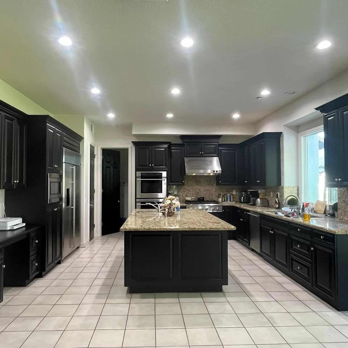 11. Ebony Classic with Granite Warmth - kitchen cabinet paint ideas