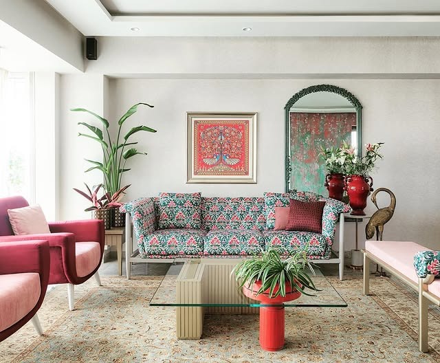 6. Pastel Floral Living Room with Accents of Coral and Green - indian style living room ideas