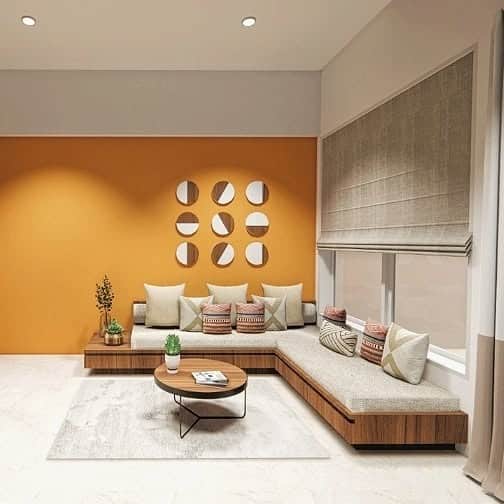 20. Orange Accent Living Room with Low Platform Seating - indian style living room ideas