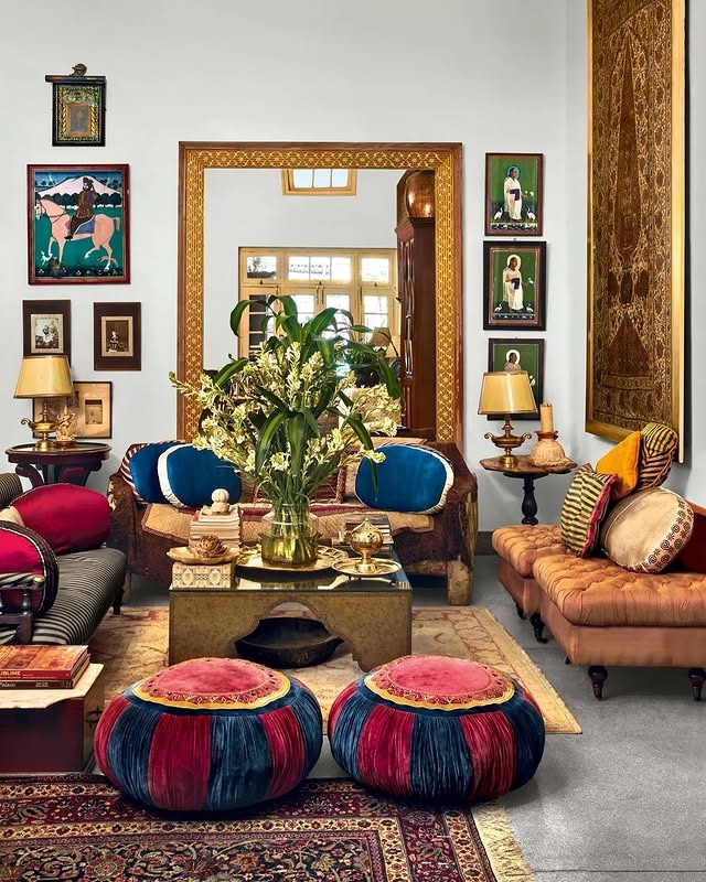 22. Regal Indian Living Room with Jewel Tones and Antique Frames - indian style living room ideas