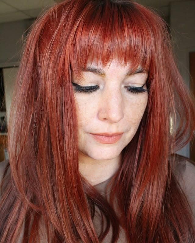 11. Rich Copper Layers With Soft Full Bangs - Bangs Hairstyles