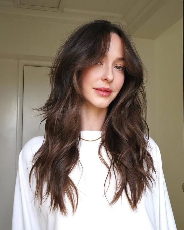 15. Tousled Chocolate Layers With Split Curtain Bangs - Bangs Hairstyles