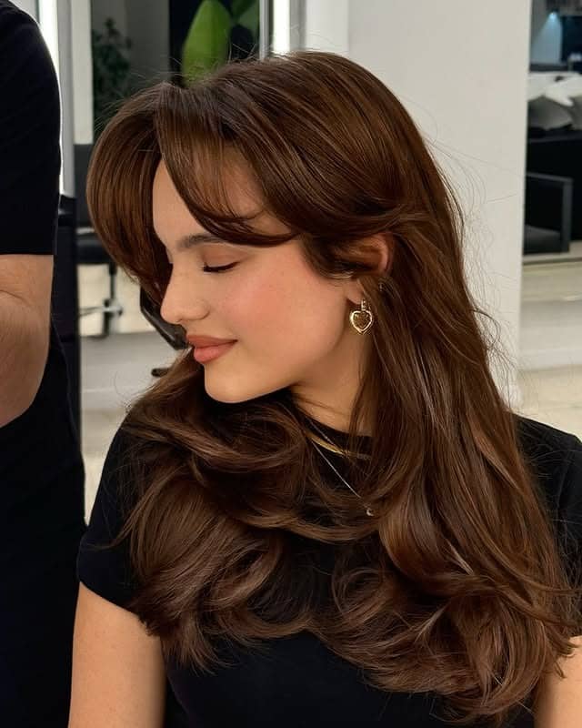 21. Chestnut Layers With Swept Curtain Bangs - Bangs Hairstyles