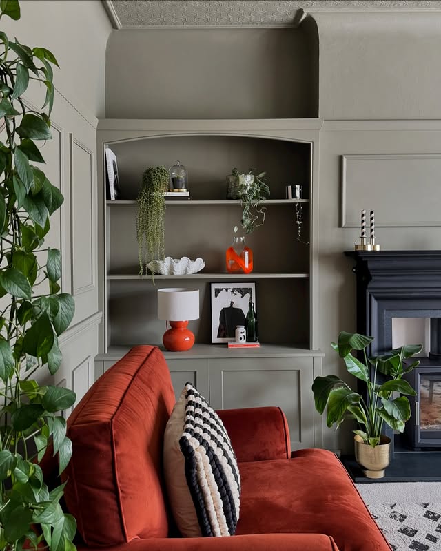 20. Olive Grey Millwork with Brick-Red Seating - paint ideas for living room