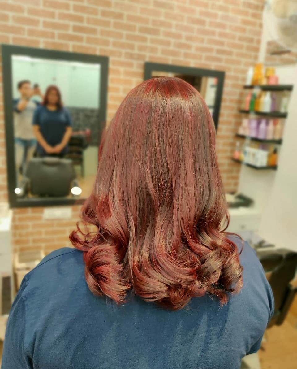 10. Warm Red-Brown Length with Soft Cascading Curls - Red Brown Hair with Highlights