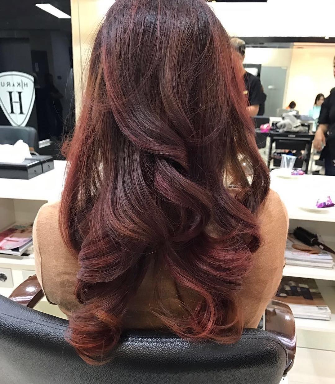 22. Deep Red Brown Cascading Curls with Dimensional Accents - Red Brown Hair with Highlights