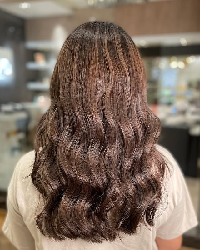 12. Warm-Toned Ash Brown Glossy Waves - Dark Ash Brown Hair Color