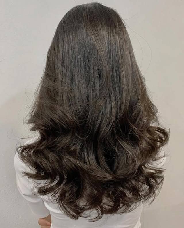 20. Gloss-Rich Ash Brown Waves - Dark Ash Brown Hair Color