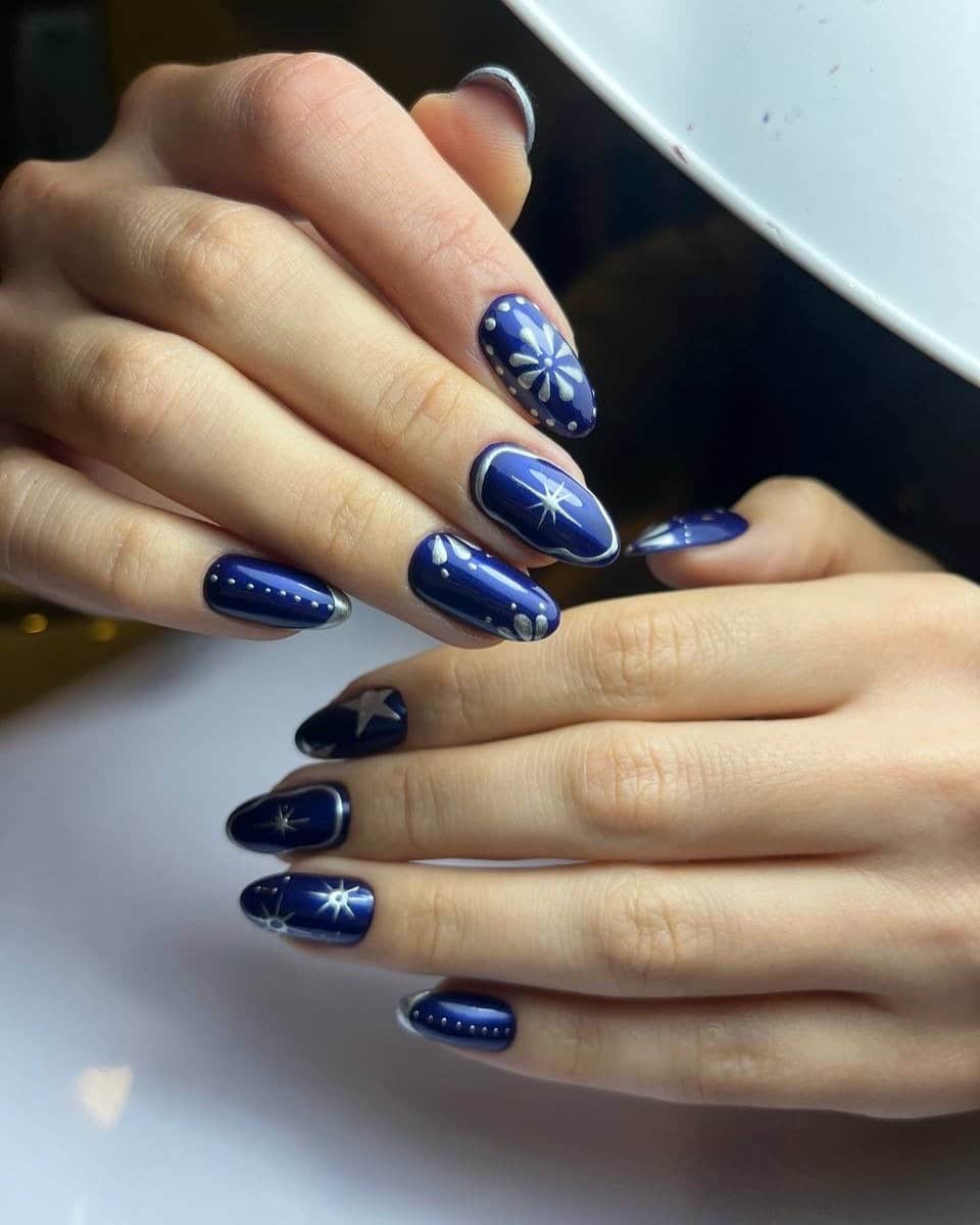 6. Midnight Blue Snowflake Nails with Silver Accents - turkey nail ideas