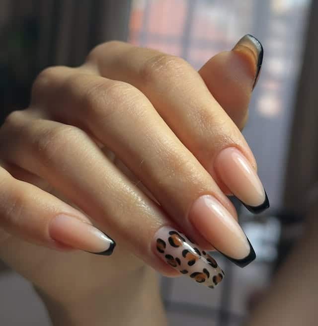 7. Black French Tips with a Leopard Accent Nail - turkey nail ideas