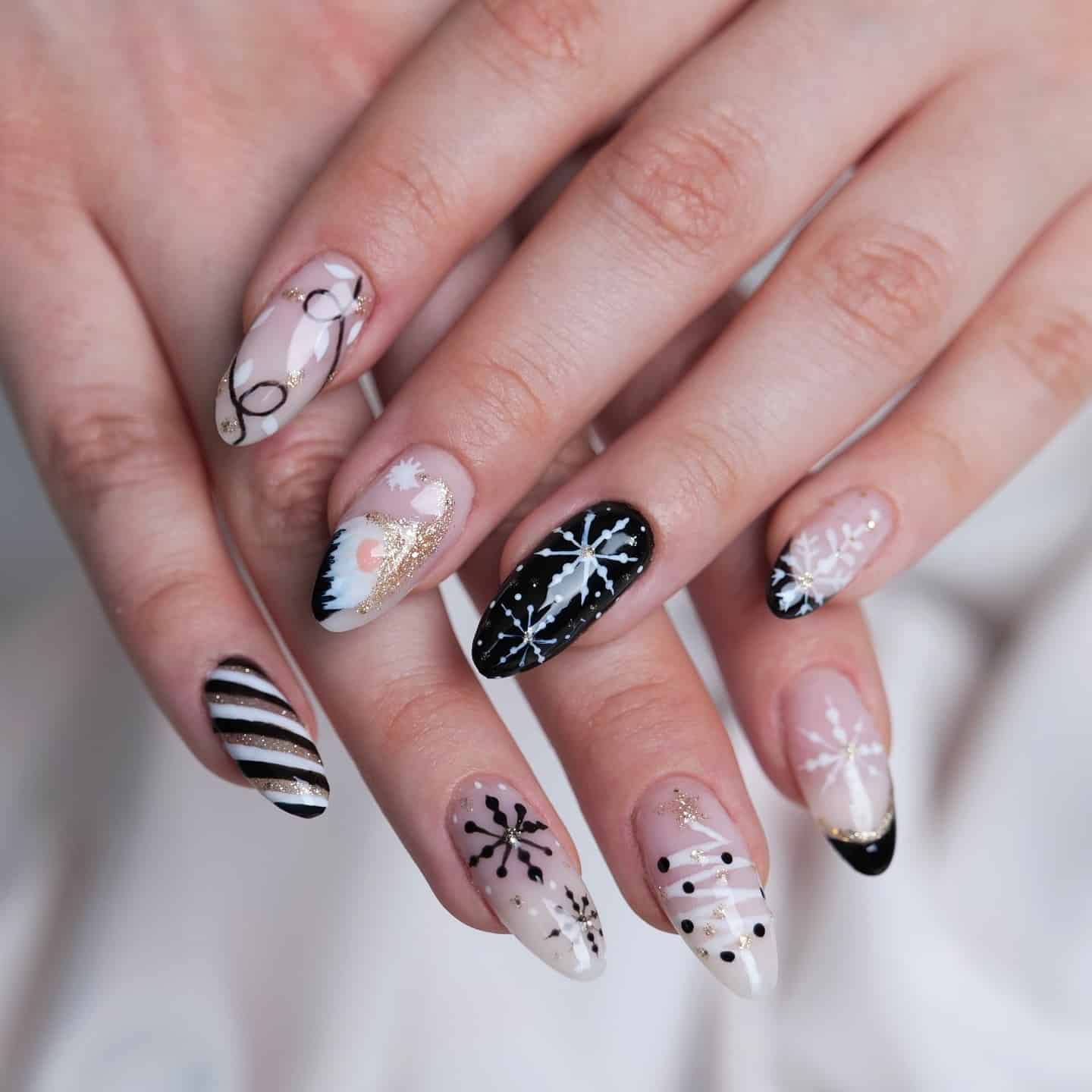 9. Black & White Snowflake Nails with Gold Touches - turkey nail ideas