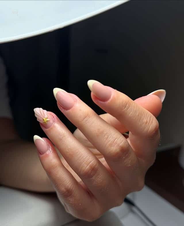 18. Cream French Almond Nails with Shell Detail Accent - turkey nail ideas