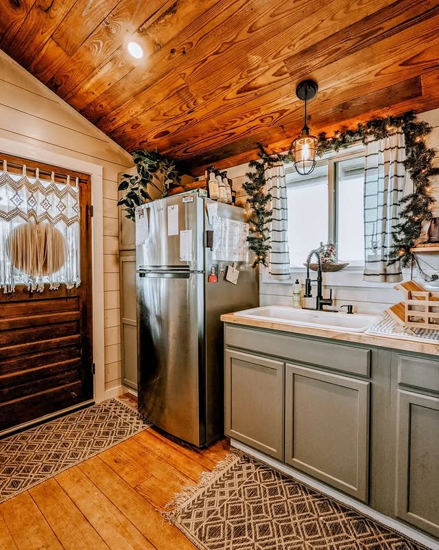 2. Cozy Rustic Kitchen With Warm Wood Accents - tiny house kitchen ideas