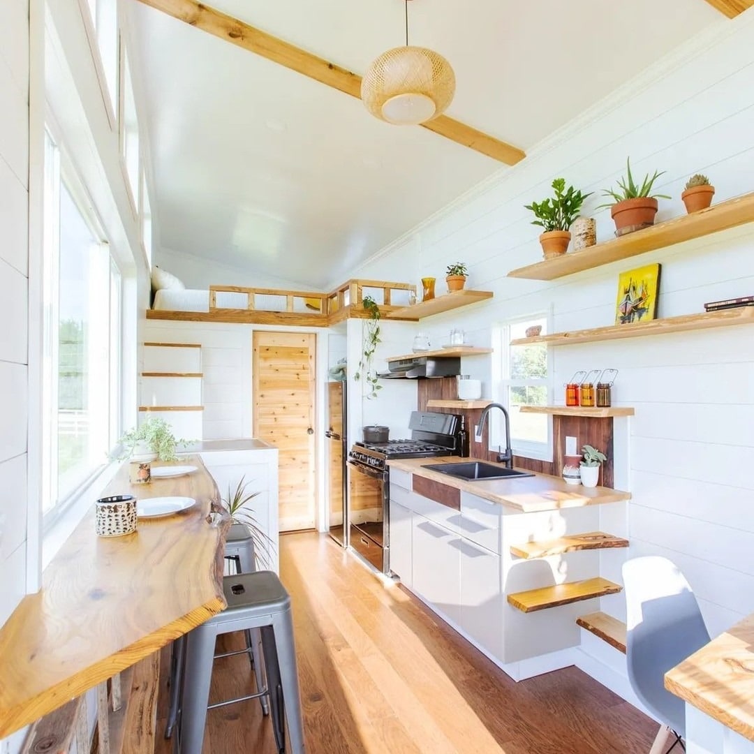 4. Light-Filled Linear Kitchen With Raw Wood Shelving - tiny house kitchen ideas