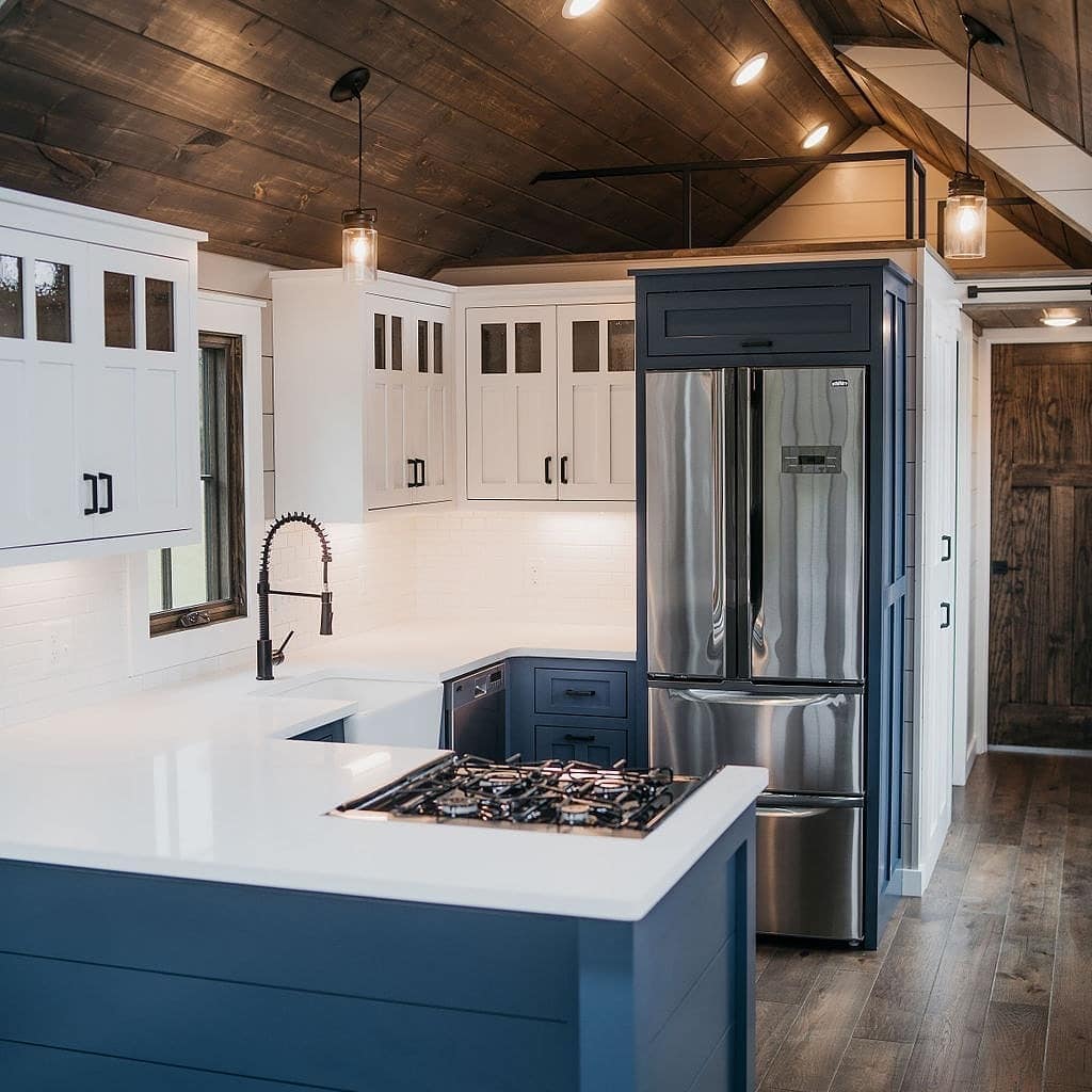 8. Navy and White Kitchen With Sculpted Ceiling Panels - tiny house kitchen ideas