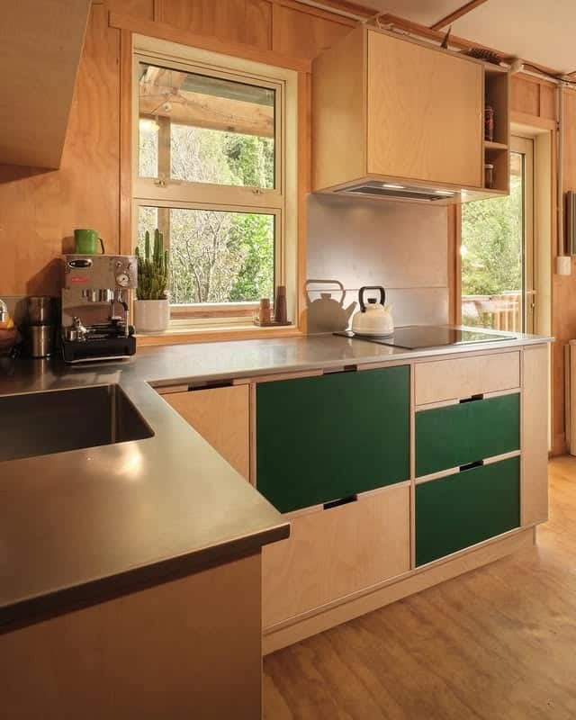9. Minimal Scandinavian-Inspired Kitchen With Green Panels - tiny house kitchen ideas