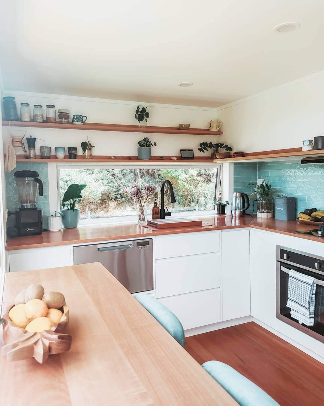 14. Bright White and Wood Kitchen With Soft Aqua Backsplash - tiny house kitchen ideas