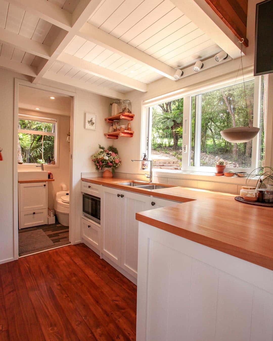 16. Soft White Shaker Kitchen With Garden Views - tiny house kitchen ideas